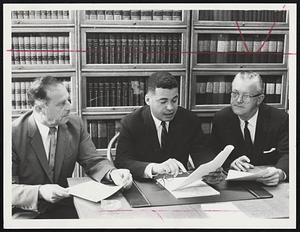 Fire Alarm Report citing conflict of interest is pointed out by Boston Finance Commission Edward W. Brooke, center, to commission members Dr. Roger left, and Joseph P. McNamara. Fin Com recommended remov m Sup t. Albert L. O'Banian and discipline for others