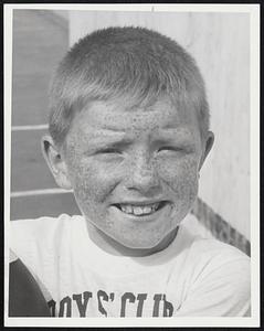 Man of Distinction - George Dunham, 8, of South Boston, flashes a championship smile after being judged the winner in the annual Freckle Contest of the Boys' Clubs of Boston at the Charles Hayden Memorial Clubhouse, South Boston.