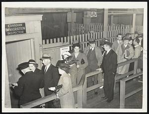 Immigration Inspection yesterday as hundreds left for Nova Scotia or New Brunswick vacation trips aboard the Eastern Steamship Lines steamer Yarmouth.