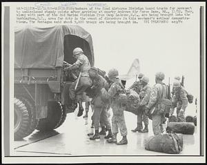 Members of the 82nd Airborne Division board trucks for movement to undisclosed standby points after arriving at nearby Andrews Air Force Base, Md., 11/12. They, along with part of the 2nd Marine Division from Camp Lejeune, N.C., are being brought into the Washington, D.C., area for duty in the event of disorders in this weekend’s antiwar demonstrations. The Pentagon said about 9,000 troops are being brought in.