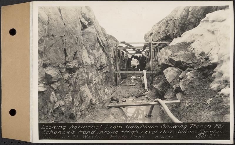 Contract No. 80, High Level Distribution Reservoir, Weston, looking northeast from gatehouse showing trench for Schenck's Pond intake, high level distribution reservoir, Weston, Mass., Mar. 6, 1940