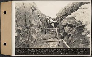 Contract No. 80, High Level Distribution Reservoir, Weston, looking northeast from gatehouse showing trench for Schenck's Pond intake, high level distribution reservoir, Weston, Mass., Mar. 6, 1940