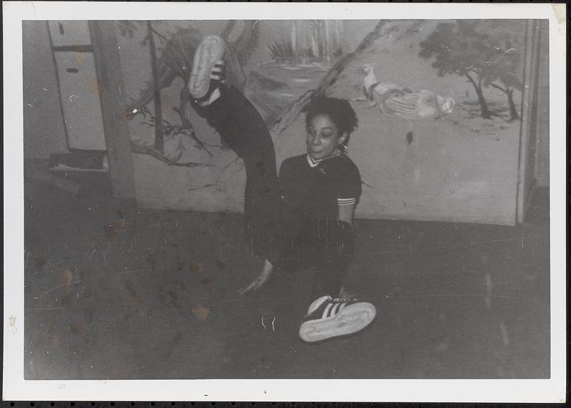 Adrianna breakdancing in the basement at Newtowne Court