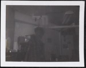 Young man standing in the basement