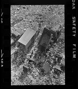 Trucks unload trash at municipal dump, Revere