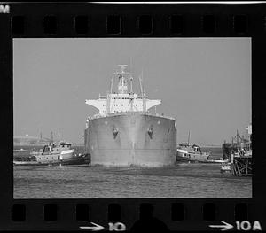 Tugs guide tanker to pier, Northern Avenue, Boston