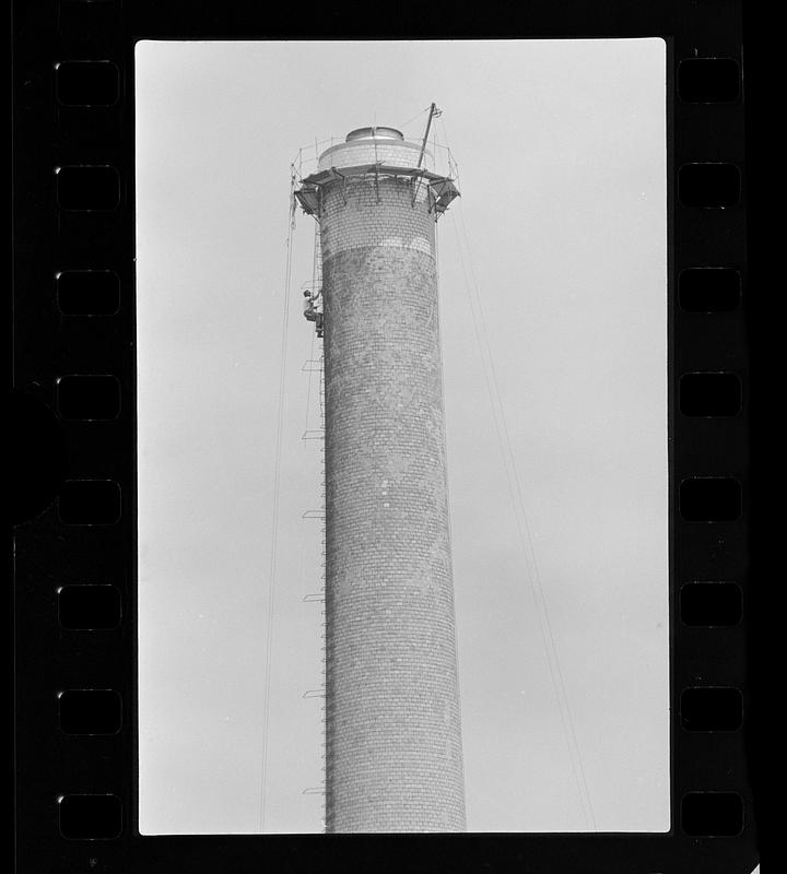 Steeplejack on factory chimney, Boston