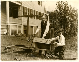Calvin Coolidge and son building a kart