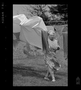 Woman and wind-blown clothesline, Monhegan Island, Maine