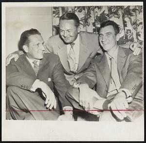 Sluggers, Past and Present, get together with Stan Hack (center) new Cubs manager and formerly on of the big guns in the National League, getting acquainted with his two slugging outfielders, Ralph Kiner (left) and Hank Sauer.