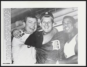 Tigers Heroes -- Detroit Tigers Norm Cash, left, and Willie Horton, right, embrace pitcher Mickey Lolich in dressing room after they defeated the St. Louis Cardinals 8 to 1 to even the World Series at one game each. The three also hit home runs in the game.