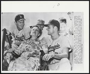 The Dream is Real - Los Angeles Dodger pitchers, Roger Craig, left and Don Drysdale, talk to Mrs. Marie Connors of Binghamton, N.Y. who has been blind since she was 24-years-old. She had always been a Dodger fan and was brokenhearted when they moved to Los Angeles. She expressed hoped that when she came to see the Hall of Fame Game here at Doubleday Field that she would be able to talk to a couple of the boys.