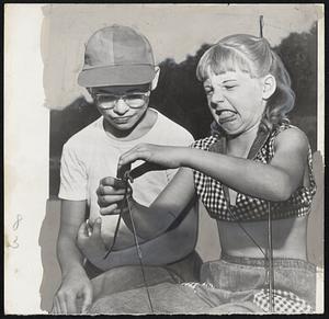 Ugh, You Worm! – Some girls like Jonetta Stephenson, 11, don’t care for worms. It’s a fish worm she holds at arms’ length and the displeasure was expressed at a YMCA “fishing rodeo” at Huntington, W. Va, for Jonetta and would be anglers like Tom Lovett, left.