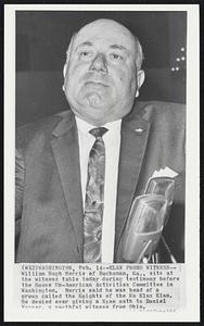 Klan Probe Witness-- William Hugh Morris of Buchanan, Ga., sits at the witness table today during testimony before the House Un-American Activites Committee in Washington. Morris said he was head of a group called the Knights of the Ku Klux Klan. He denied ever giving a Klan oath to Daniel Wagner, a youthful witness from Ohio.