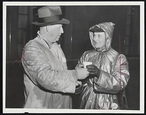 Picketing The Phone Company – Charles Harrington of Arlington and Julia Romberg of Belmont, Western Electric Company pickets, take coffee in the line around the New England Telephone & Telegraph Company building on Franklin street.