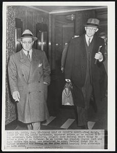 Throws Self on Court's Mercy -- Fred Saigh, owner of the St. Louis Cardinals, appeared solemn as he walked with his attorney, R.H. McRoberts, (right) into federal court today to offer a plea of no defense to an income tax evasion charge just six days before his trial was scheduled to open. Federal Judge Roy W. Harper withheld his ruling on the plea until hearing from attorneys on both sides.