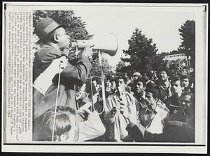 Urges Demonstrators to Keep Their Cool--Carlton Goodlett, publisher of a weekly newspaper, using a bullhorn after being hoisted onto the shoulders of demonstrators on trouble-ridden San Francisco State College tells an estimated crowd of 1,000 "...if we keep our heads, no violence should emanate from this quarter." He spoke as about 500 policemen moved onto the campus to disperse a rally. The demonstrators retreated and there was no renewal of Tuesday's wild melee.