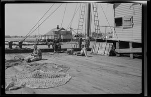 Fishermen on a boat deck, Nantucket