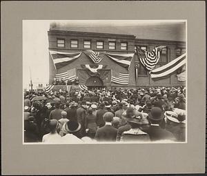 Senator Crane speaking to crowd at Homecoming, 1913