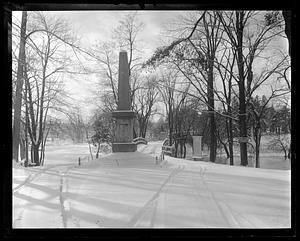 The Granite Obelisk and the North Bridge covered in snow, Concord