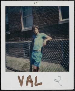 Val Postell posing on a fence