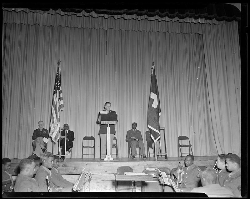 Speaker at lectern on stage