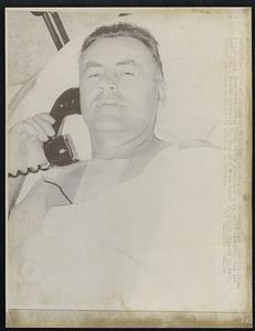 Heart transplant patient, Carl Van Bates, 50, an Amarillo, Texas prescription shoe store owner, talks on the phone 8/20 a day after receiving his new heart from a Houston housewife who died of a brain tumor 8/19. Bates remains in satisfactory condition at St. Luke's hospital in Houston.