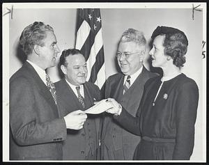 The Mayor Contributes to the Red Cross- Mayor John E. Kerrigan is shown giving his check for $100 to Mrs. John Maxwell Colburn, staff secretary of the public employes' division of the 1945 Red Cross campaign. Frank S. Fahey, city registrar, and James H. Flanagan, city treasurer, look on.