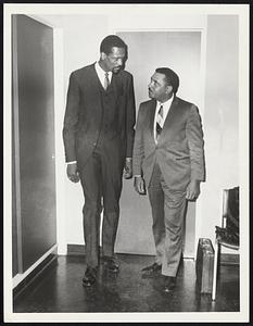 Bill Russell + Frank Morris leaving B.B.A. after meeting with officials.