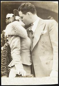 A Kiss For The Bride – Glen “Rip” Russell, first baseman of the Chicago Cubs, gives a hearty kiss here to his bride, the former Lois Gladys Chamberlain, 20, of Long Beach, Calif., after they were married yesterday afternoon. Mrs. Russell was divorced only a week ago at Reno, Nev., from Joseph F. O’Connor.