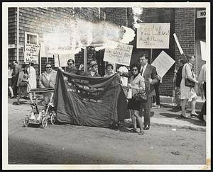 Pickets hold pup tent outside 551 Green St., Cambridge, with sign that reads: “Mt. Speculator, you will not force our model city residents to live in tents! The Model Cities Board.” Group protested rent hikes.