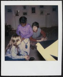 Woman sitting with two girls