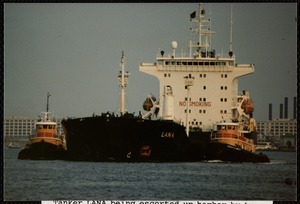 Tanker Lana being escorted up harbor by tugs