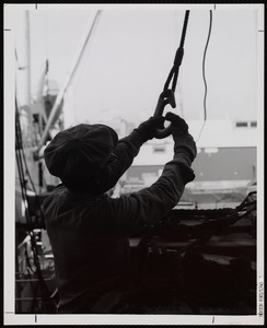 A Waterfront worker secures a winch at the Port of Boston