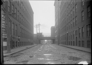 "A" St. from Congress showing Summer St. viaduct. Floyd's Quicker Lunch.