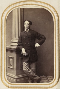 Portrait of a man standing by a column [R.B?]
