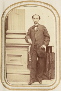 Portrait of a man standing by a column and top hat [B.A.O.?]
