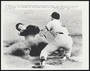 Cleveland pitcher Sam McDowell is picked off at first base by Washington first baseman Joe Cunningham during 8th inning, here 7/29. Nats won in 12 innings, 4-1.