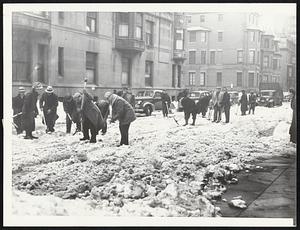 Pick and Shovel Work was necessary to clear any of the streets where the snow became hardpacked. This crew is at work on Exeter street.