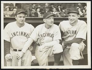 The man on the left helped, too keeping a close eye on the game as the Cincinnati Reds clinched the national League pennant in Philadelphia, sept. 18, are (left to right) Coach Jimmy Wilson, manager Bill McKechnie and pitcher Bucky Walters. McKechnie had high praise for Wilson, who is 40 years old and came back into the lineup to catch after Ernie Lombardi was injured. "It was Jimmy who really put us over the top," said McKechnie.