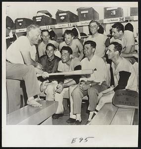 Milwaukee Braves manager Charlie Grimm, coach Bob Keely, and players, including Gene Conley, Danny O'Connell, Warren Spahn, and Bobby Thomson