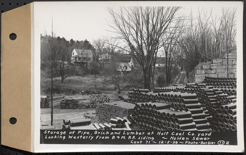 Contract No. 71, WPA Sewer Construction, Holden, storage of pipe, brick and lumber at Holt Coal Co. yard looking westerly from Boston and Maine Railroad siding, Holden Sewer, Holden, Mass., Dec. 5, 1939