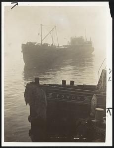 Not Spectre, But Ship, is the gasoline tanker Lucy, shown passing the Boston tug Powow in the fog which gripped Boston harbor and the New England coast for 48 hours.