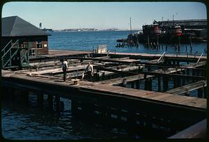 Two men on a half-built pier