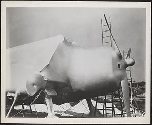 Hellcat, encased in its plastic "cocoon," undergoing evaluation of long-term storage techniques