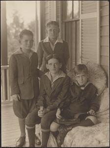 Four boys, formal portrait on a porch