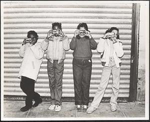 Inez Nic Nic (Nelson), second from the left, and three others seen behind their cameras