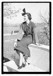 A model posing by the Oliver Wendall Holmes Memorial Sundial