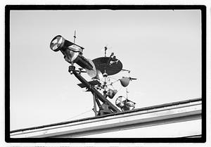 An elaborate device on roof, possibly a weather vane