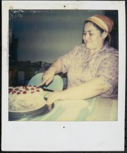 Woman cutting a cake
